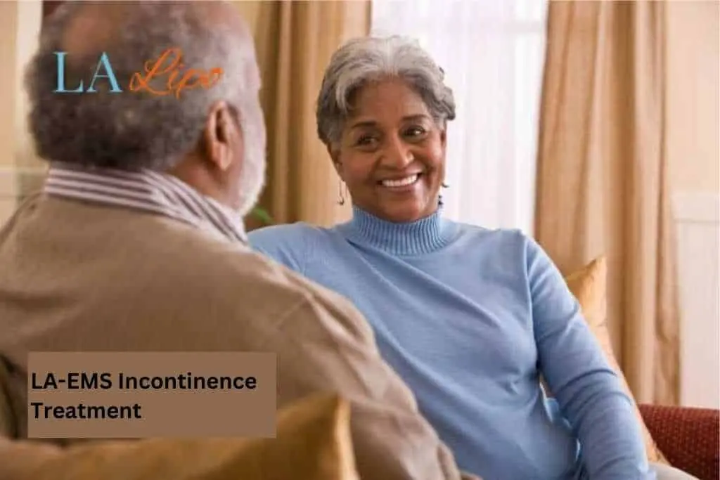Couple sat smiling at each other - LA-EMS treatment Rochdale